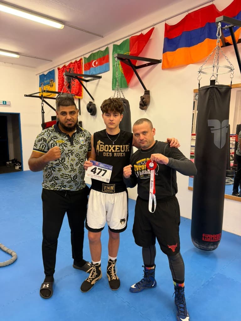 Medal winner with coaches
